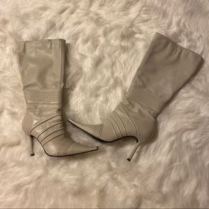 Cream colored tall boots zipper on the side